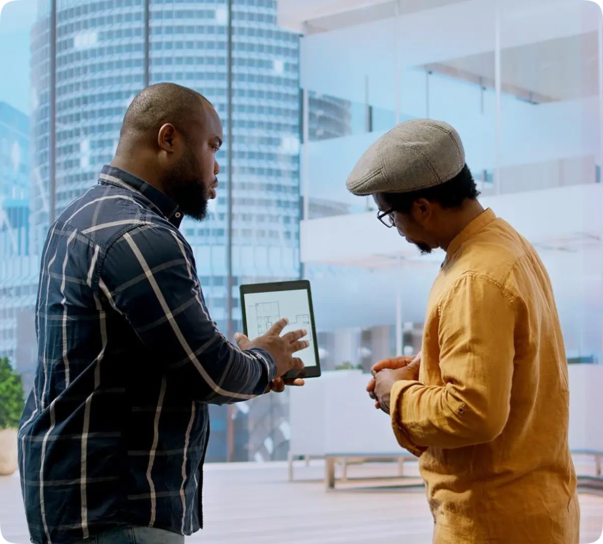 two men discussing over a tab