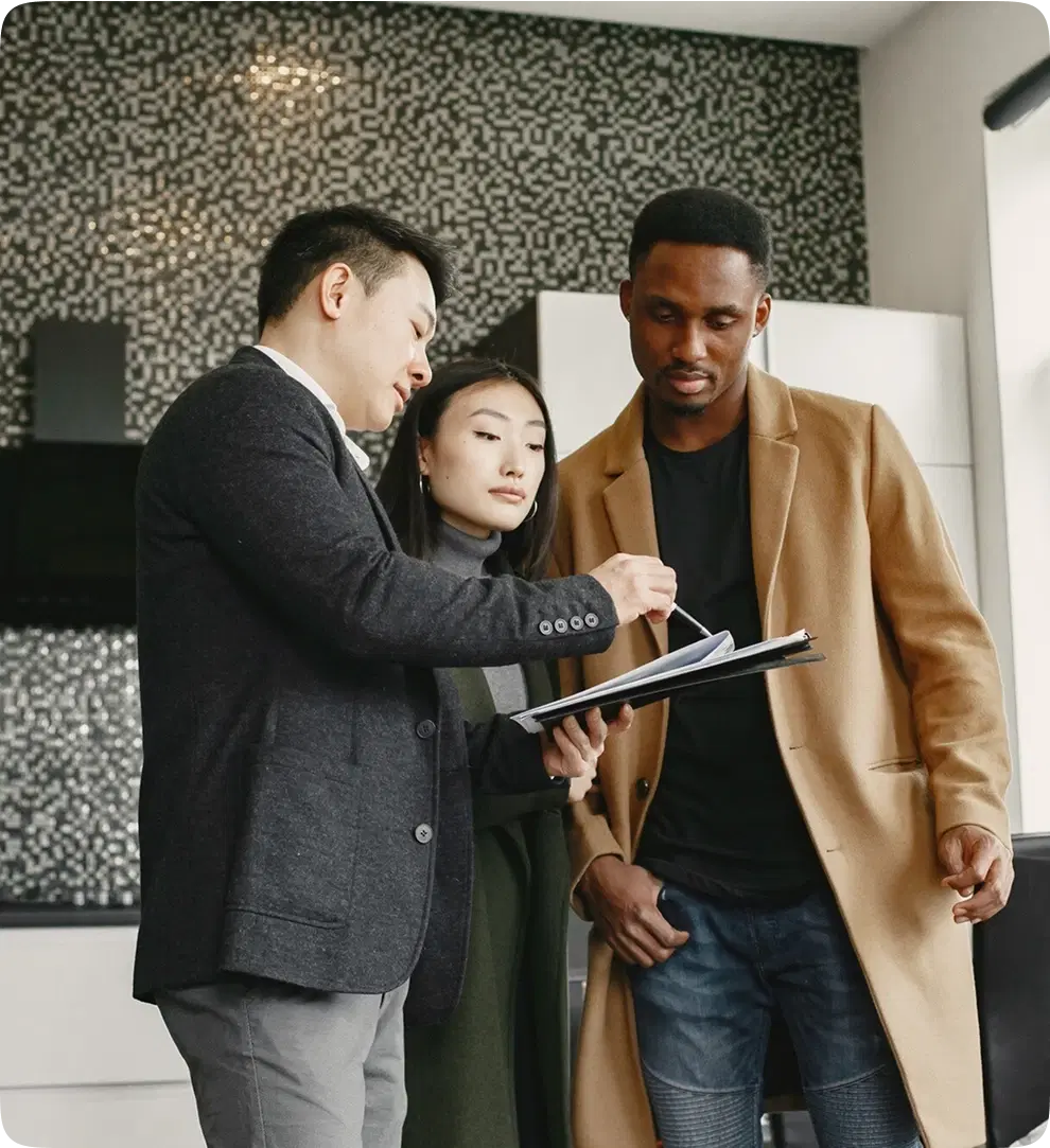 3 professionals looking at a tab screen